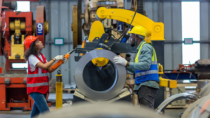 Workers handling equipment